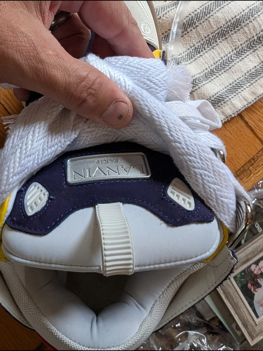 Lanvin Curb Sneakers in a distinct Navy Blue, White, Red, and Yellow colorway.